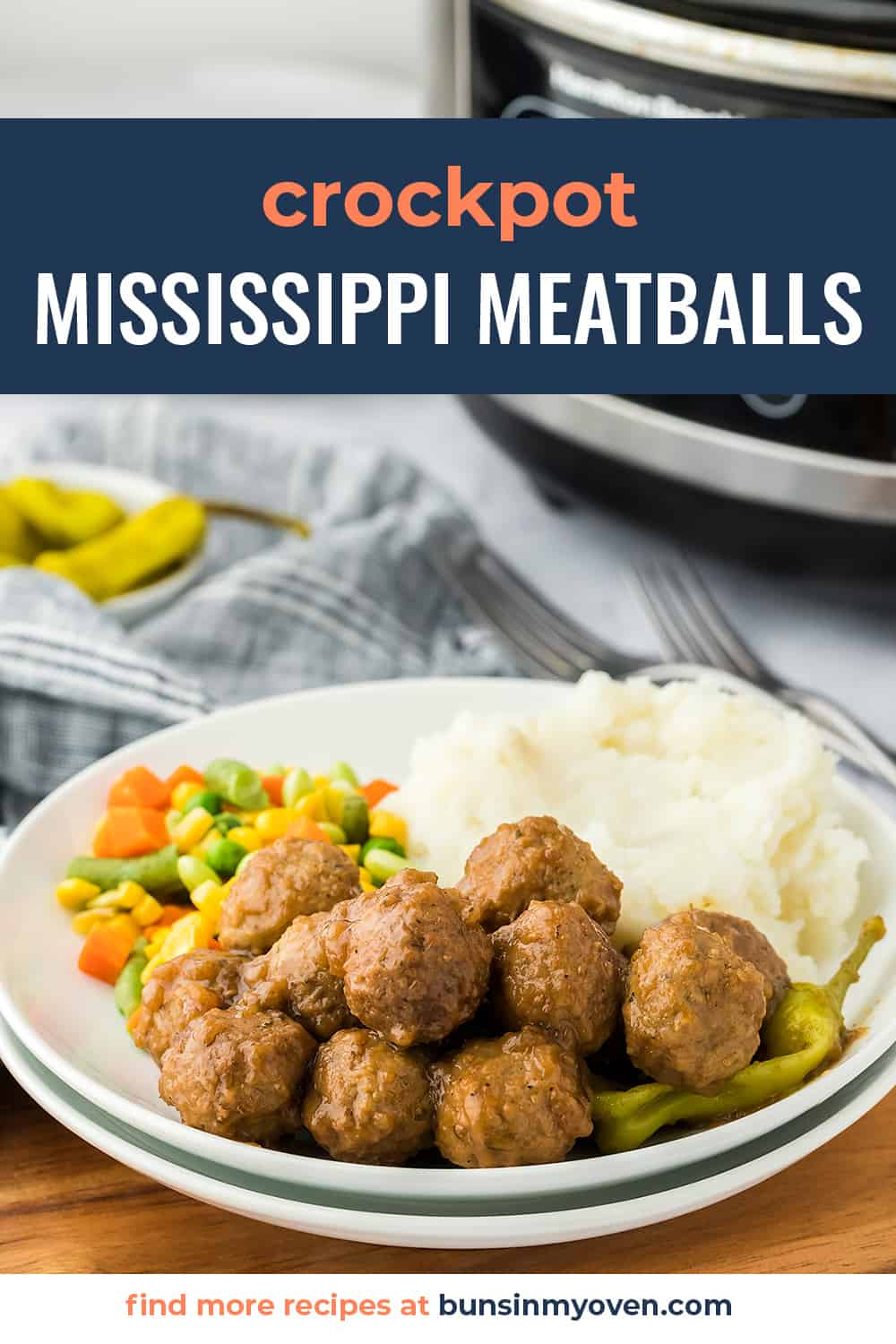 Mississipi meatballs on white plate with mashed potatoes and mixed vegetables.