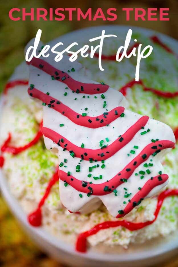 Christmas dessert dip topped with LIttle Debbie Christmas Tree Cake in white bowl.