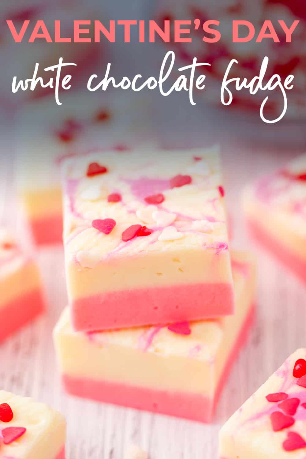 White chocolate fudge stacked on counter.