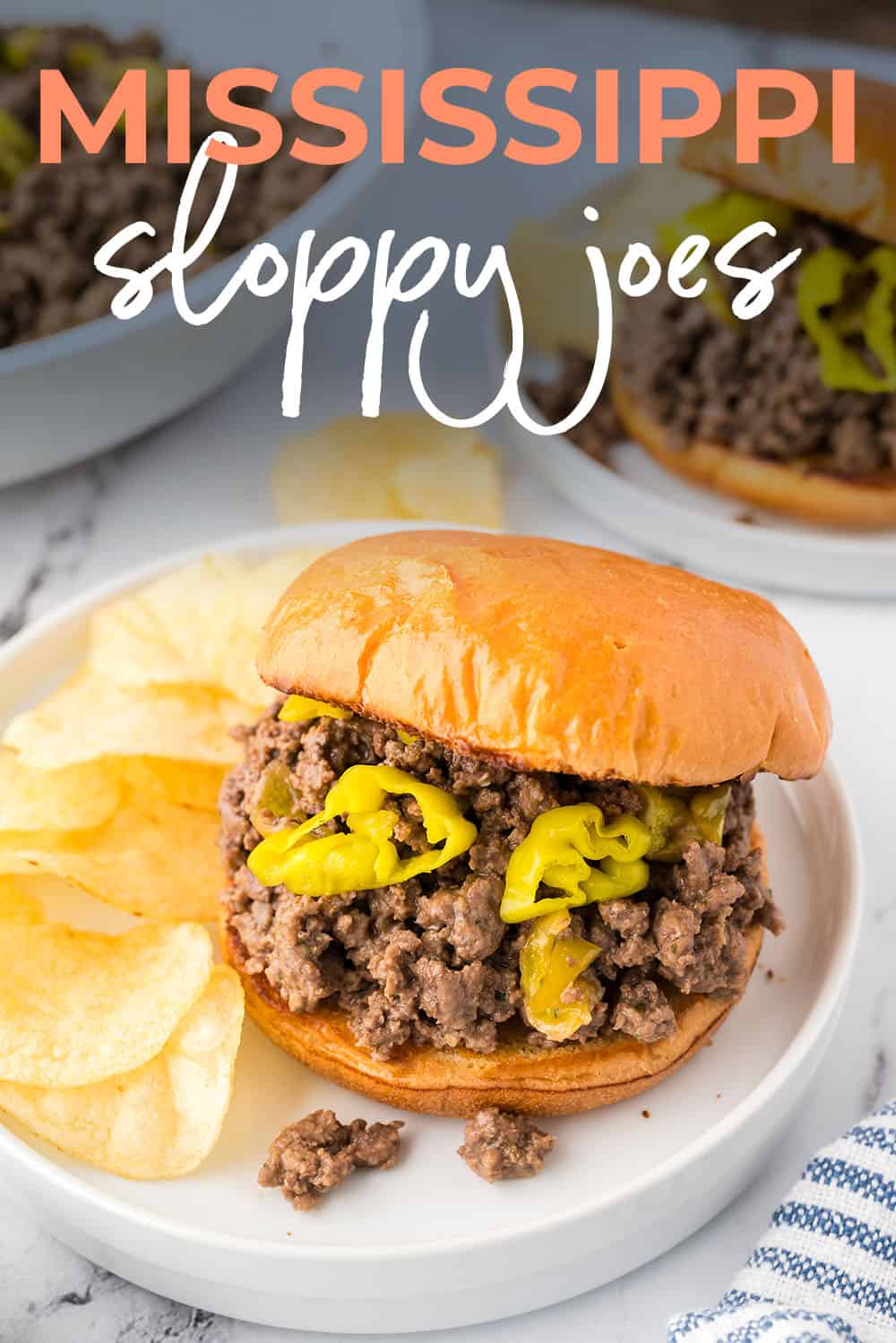 Mississippi sloppy joe on white plate with chips.