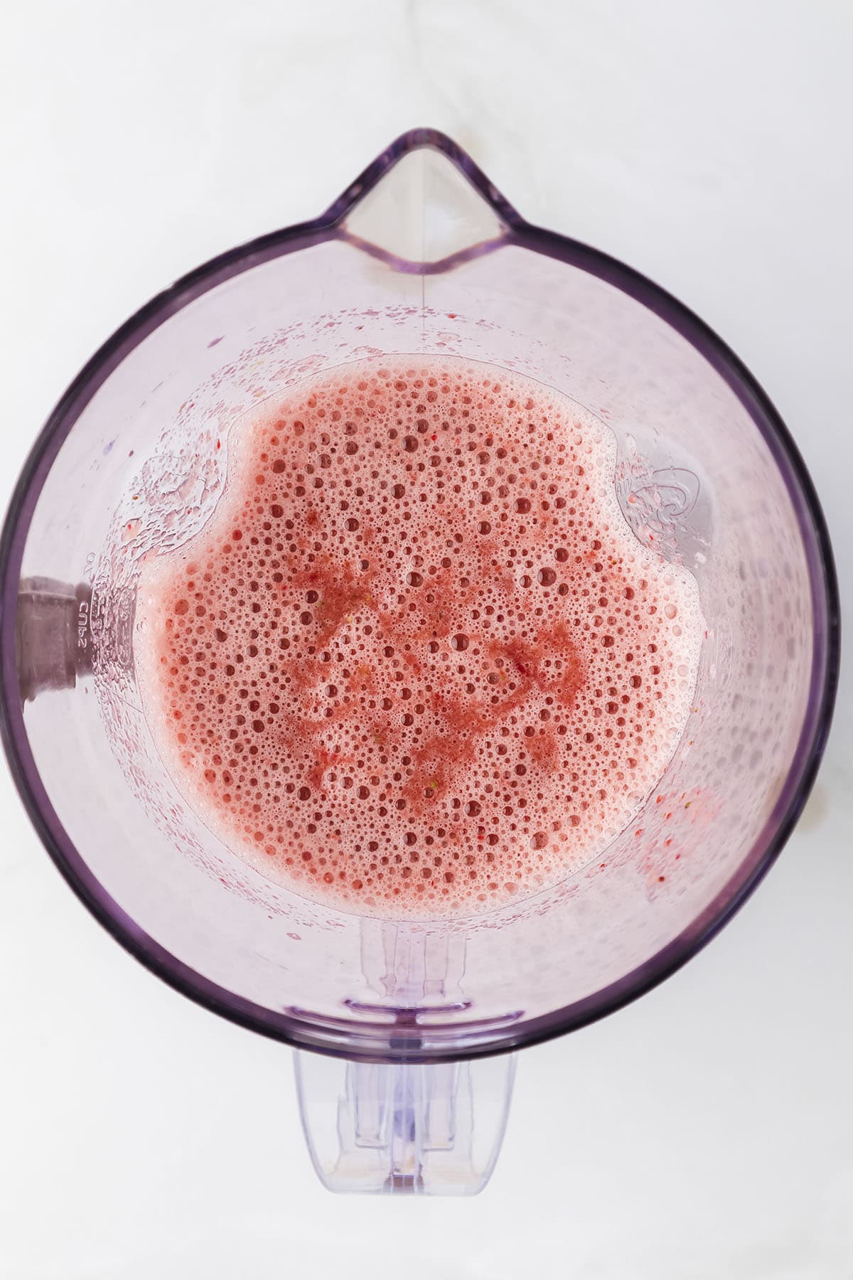 Blended strawberries in blender.