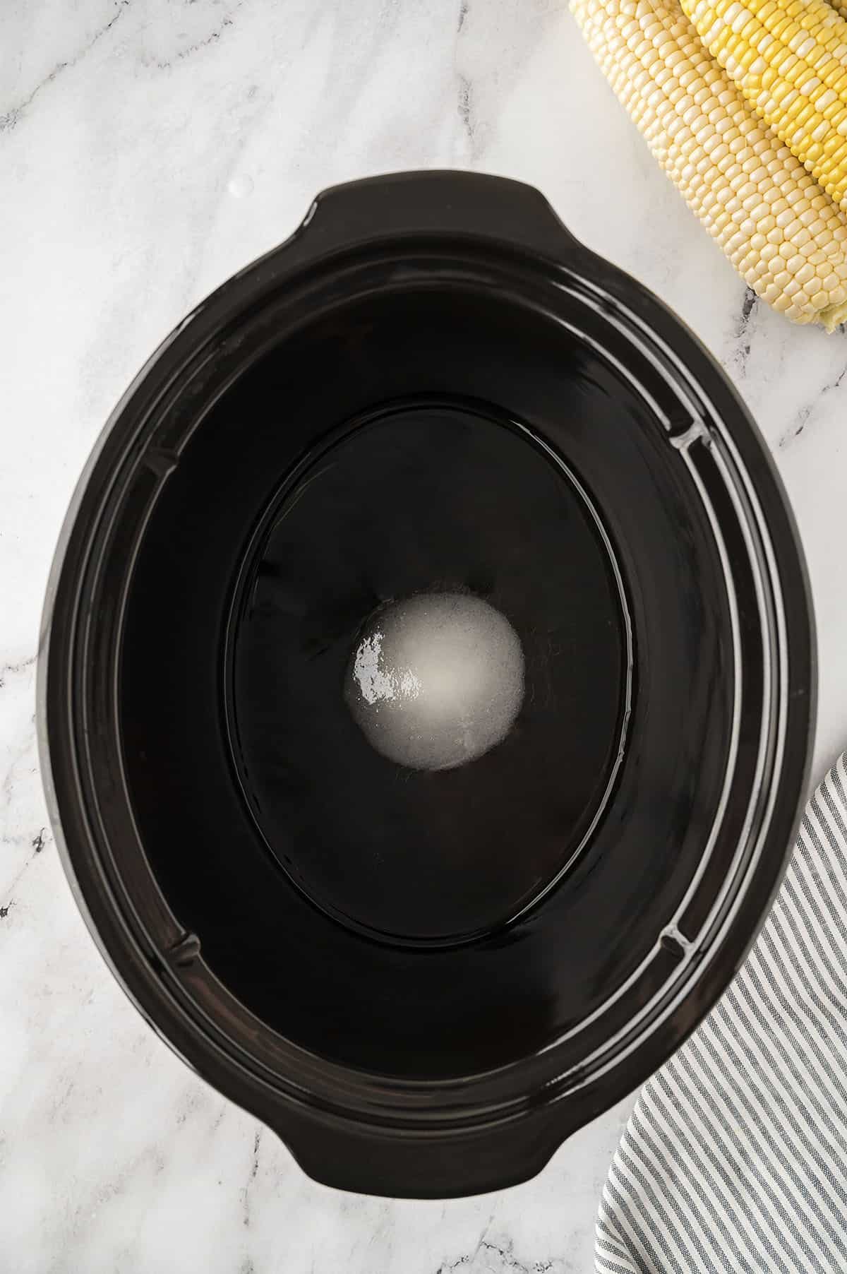Sugar and water in crockpot.