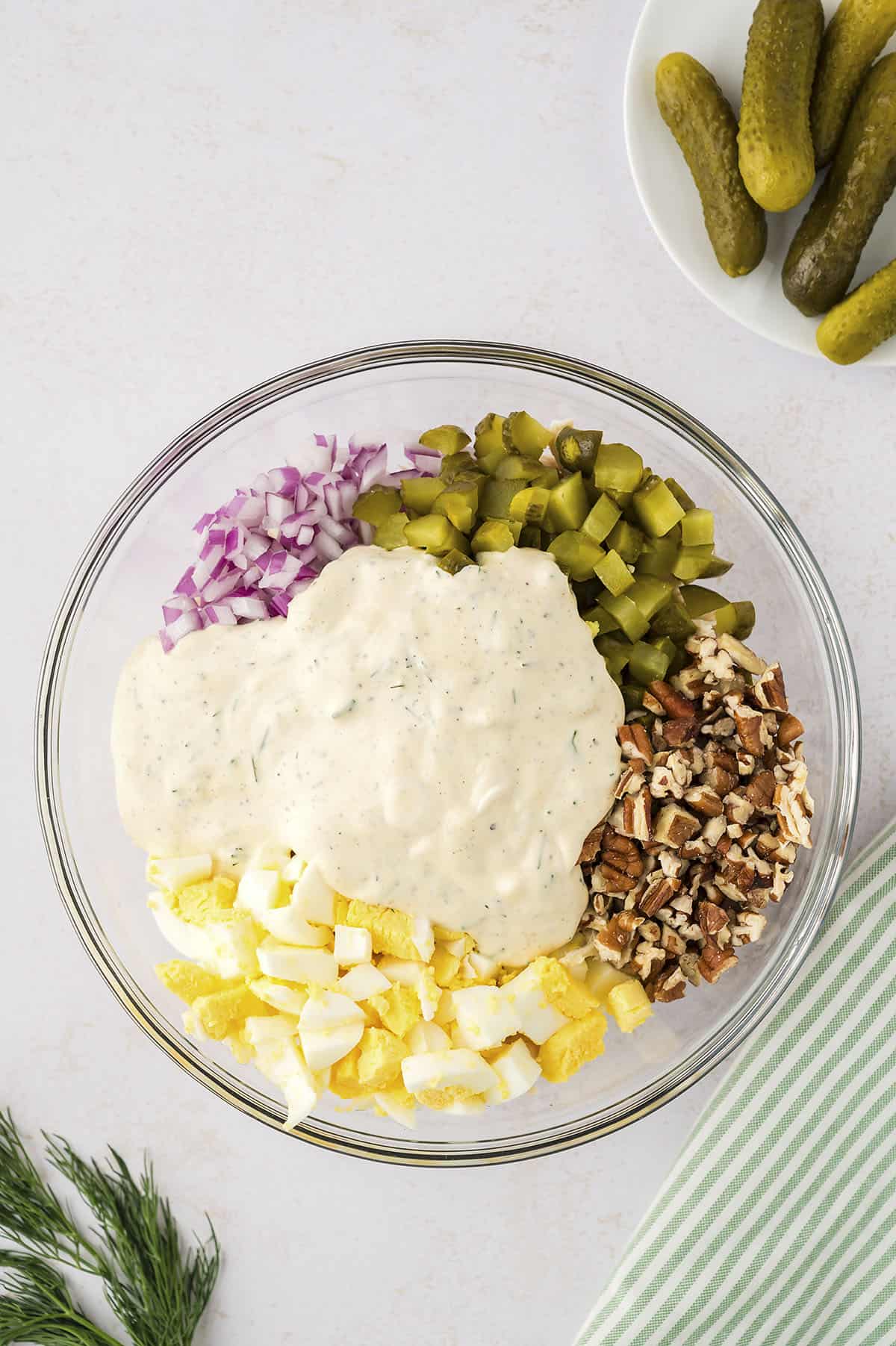 Chicken salad with mix-ins and dressing in bowl.