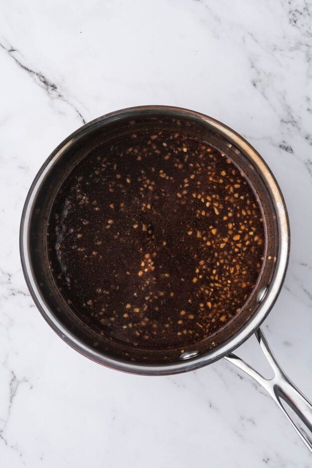 Sauce pan full of hot honey glaze.
