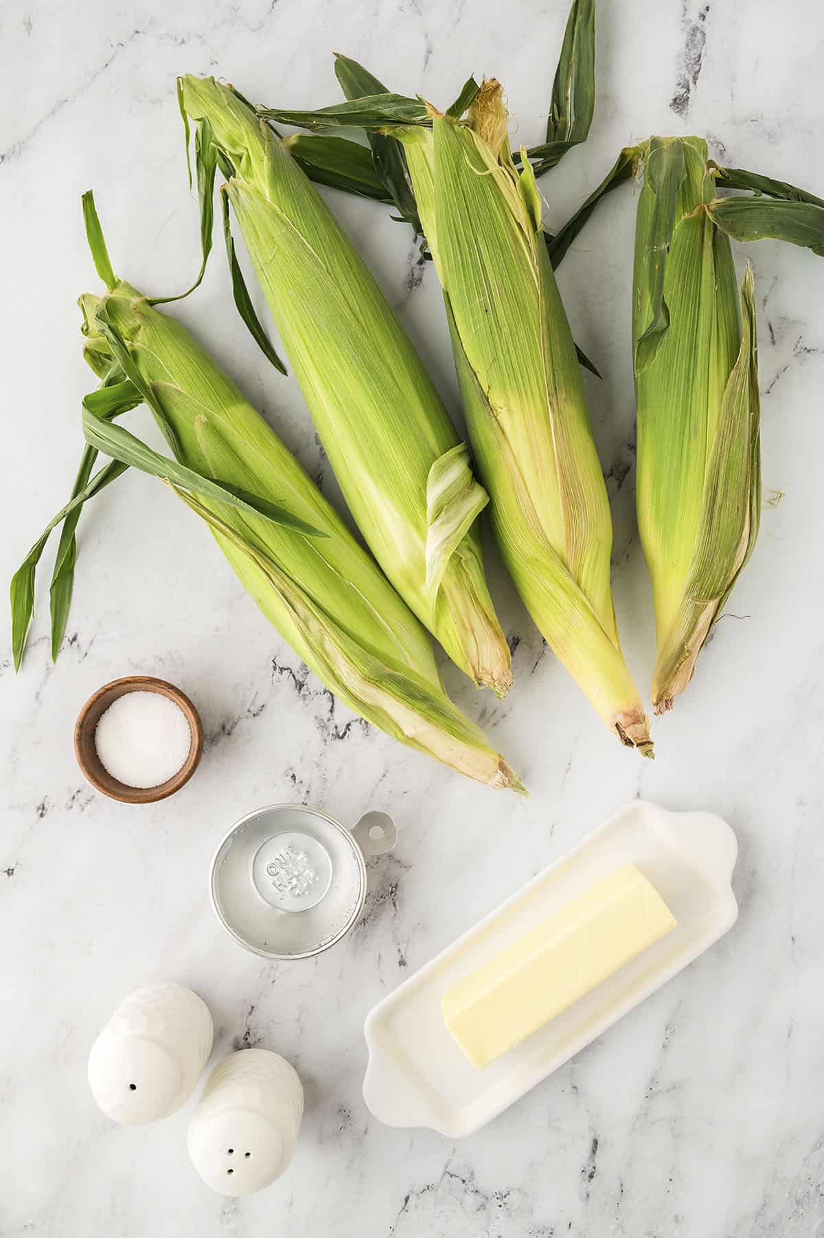 Ingredients to make corn on the cob in the crockpot.