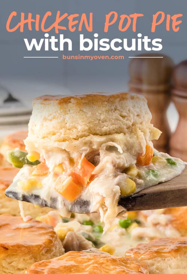 Biscuit topped pot pie on wooden spoon.