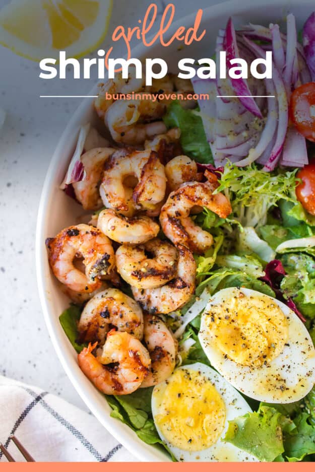 Grilled shrimp over bed of lettuce.