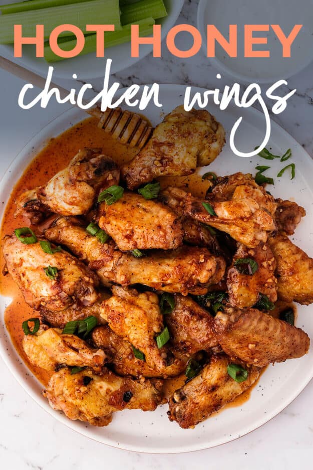 Hot honey wings on white plate with text for Pinterest.