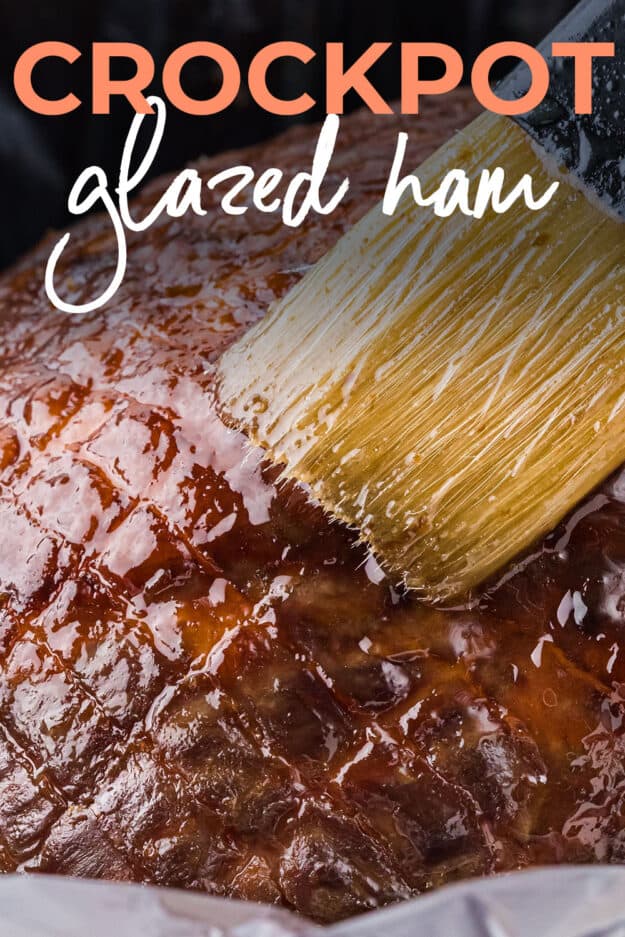 Glaze being brushed over crockpot ham.
