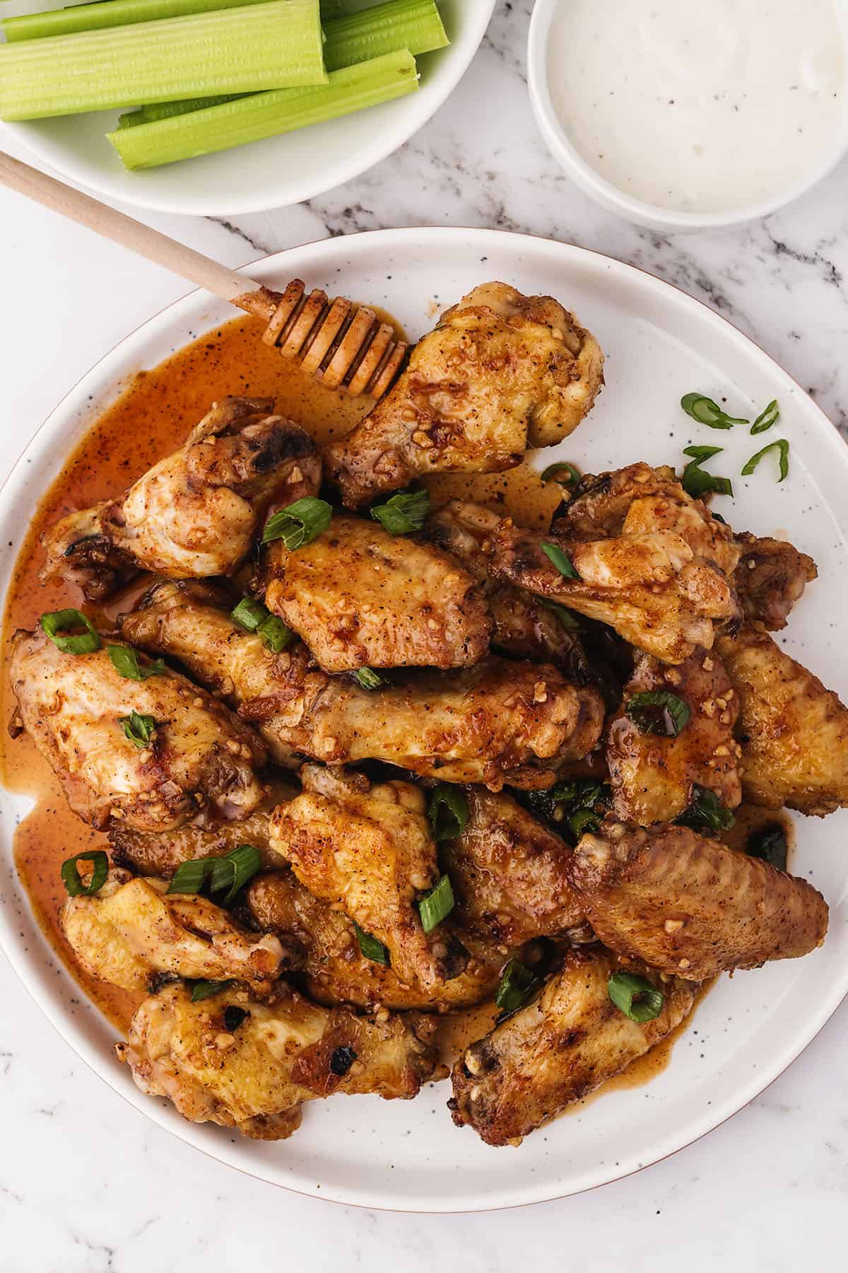 Plate full of hot honey chicken wings.