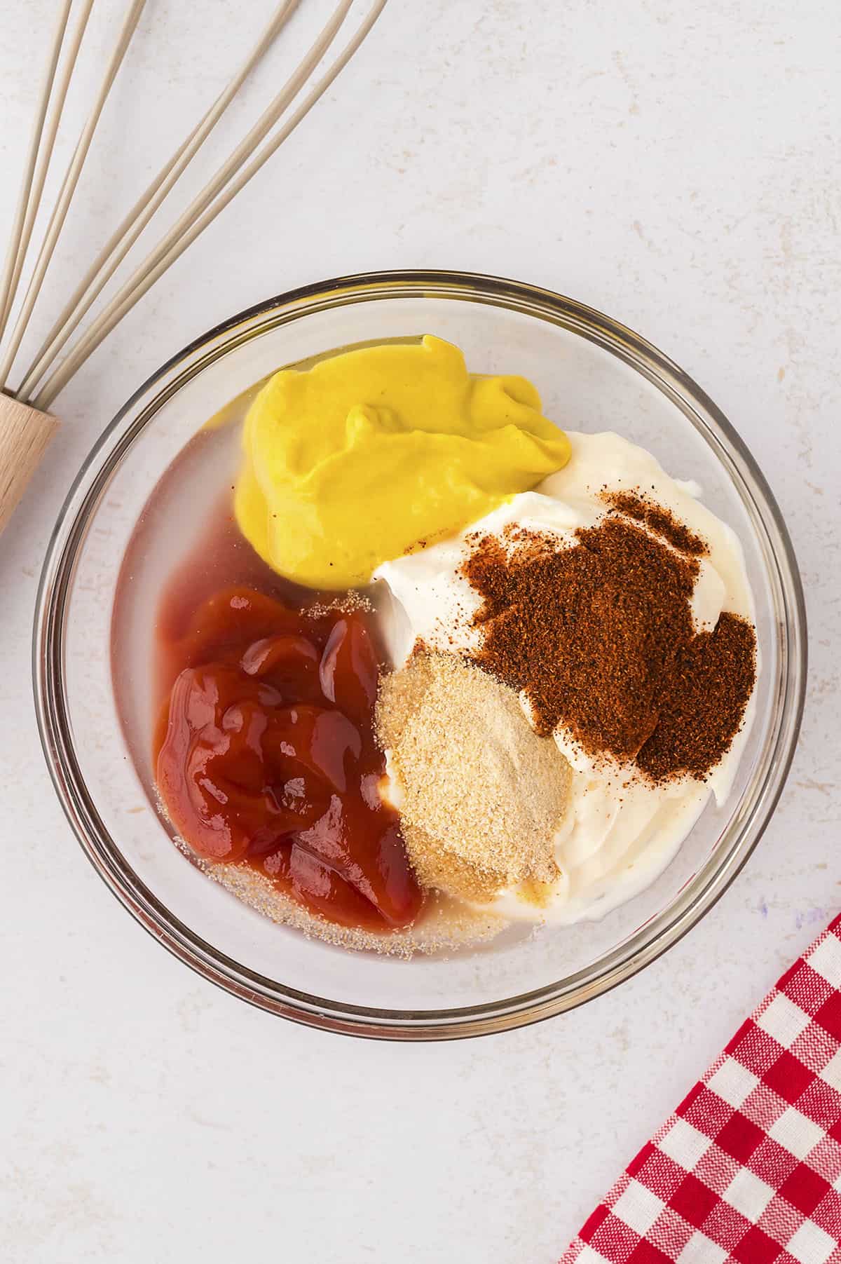 Ingredients for smashburger sauce in mixing bowl.