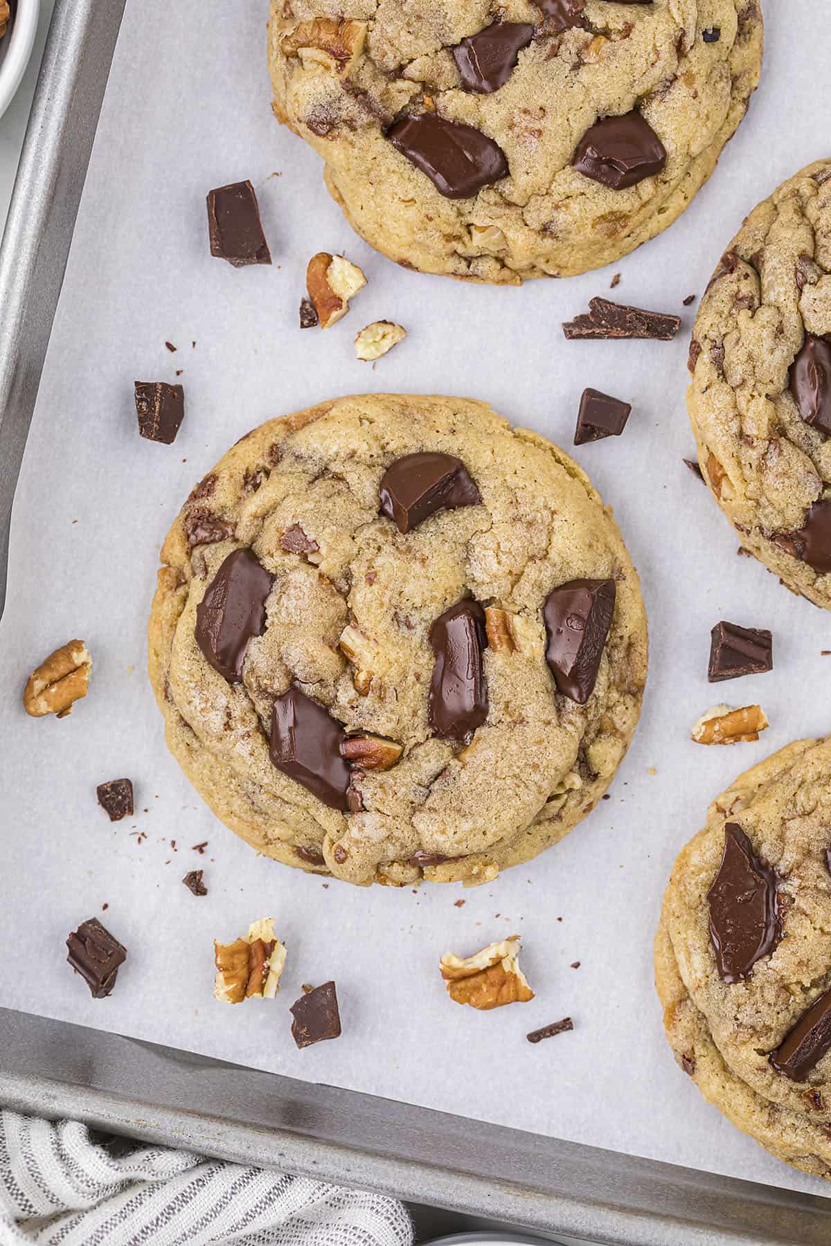 Baked toffee chocolate chip cookies on baking sheet.