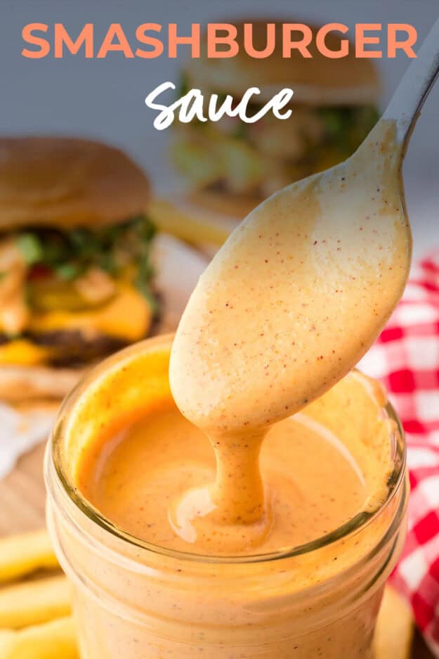 Smash burger sauce dripping off spoon into jar of sauce.