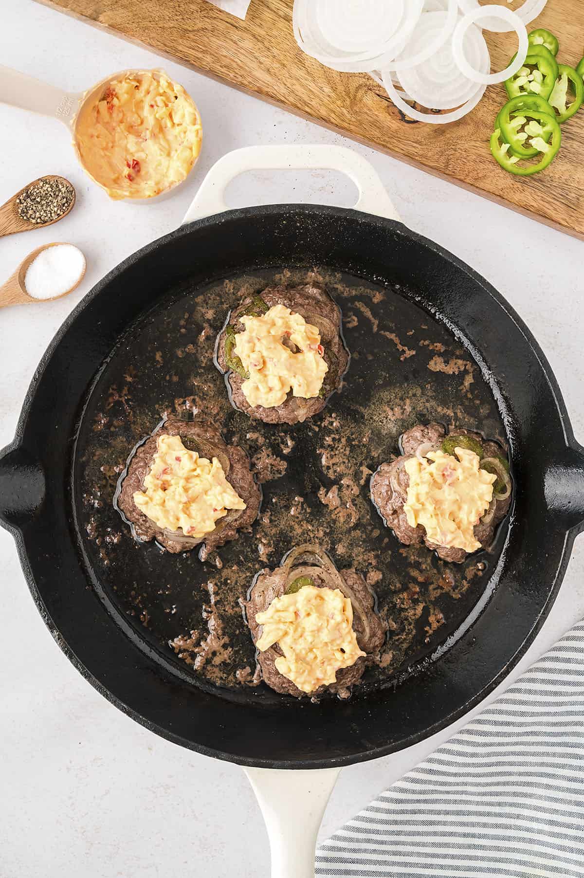 Smash burgers topped with pimento cheese.