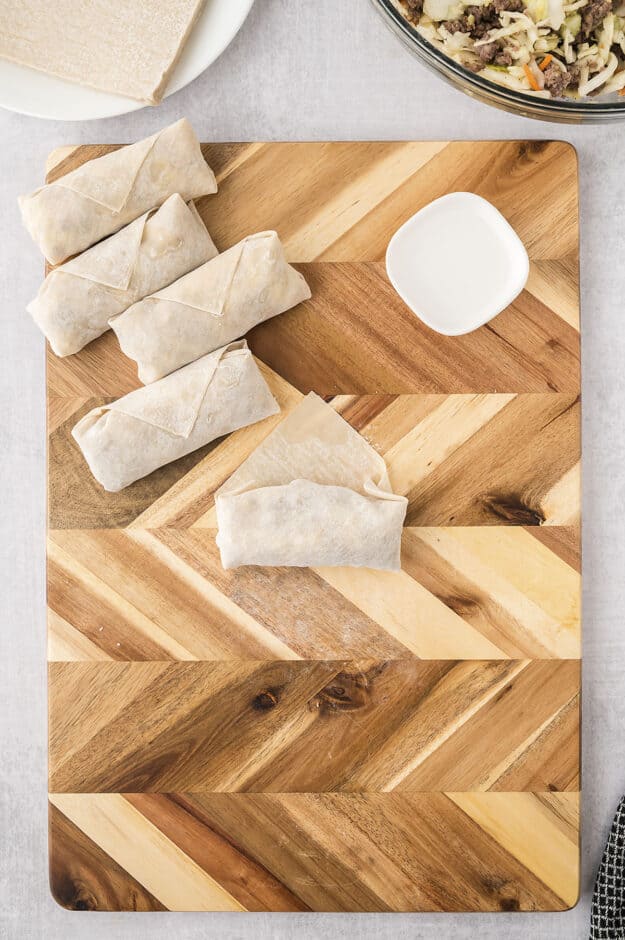 Final step of how to wrap an egg roll.