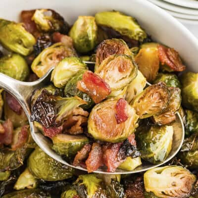 Spoon full of roasted brussels sprouts with maple and bacon.