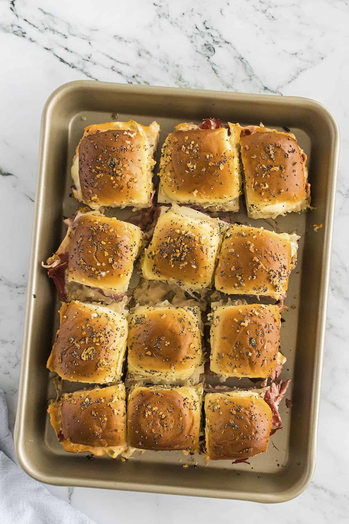 Pan full of reuben sliders.