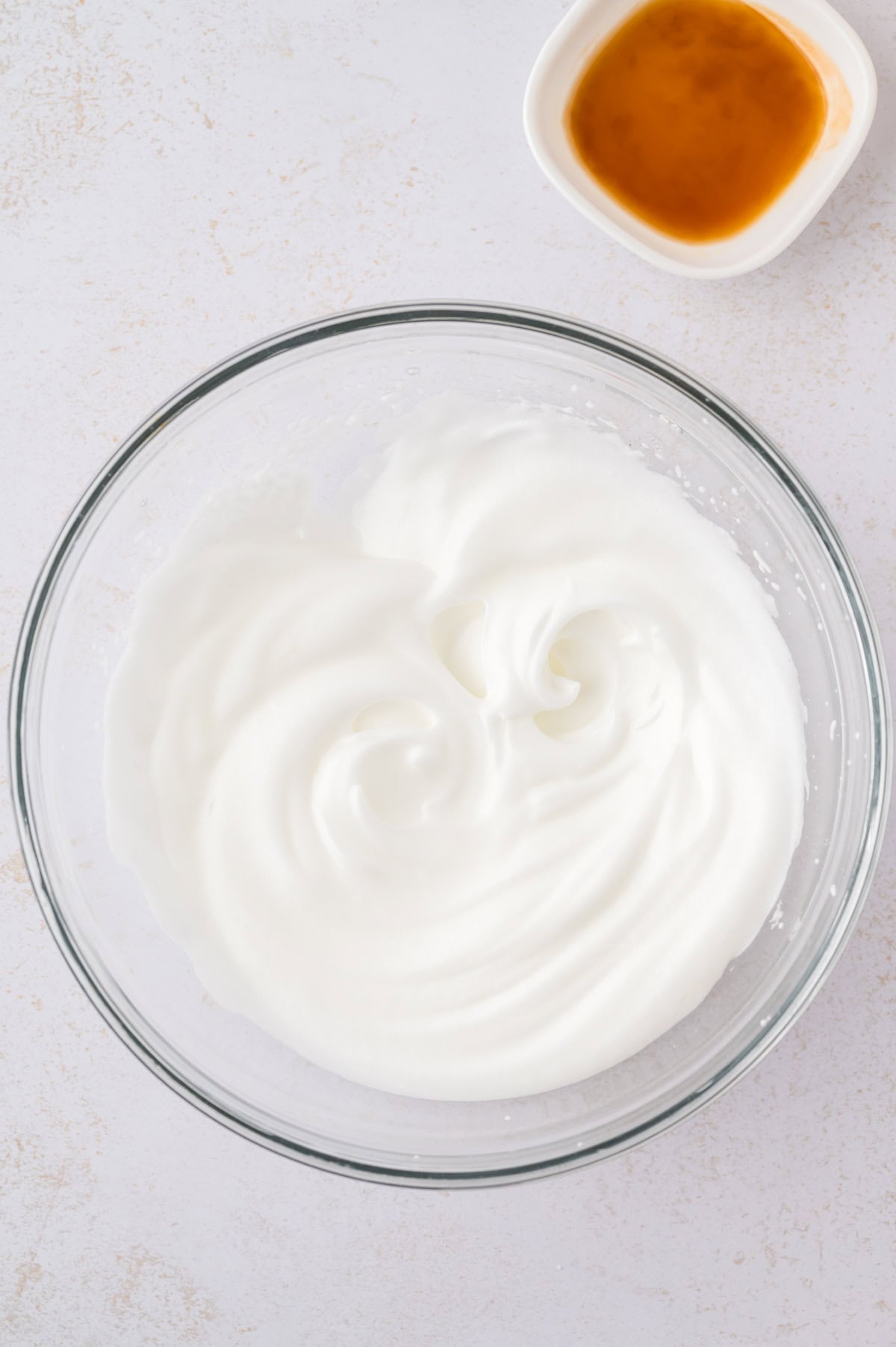 Beaten egg whites in mmixing bowl.