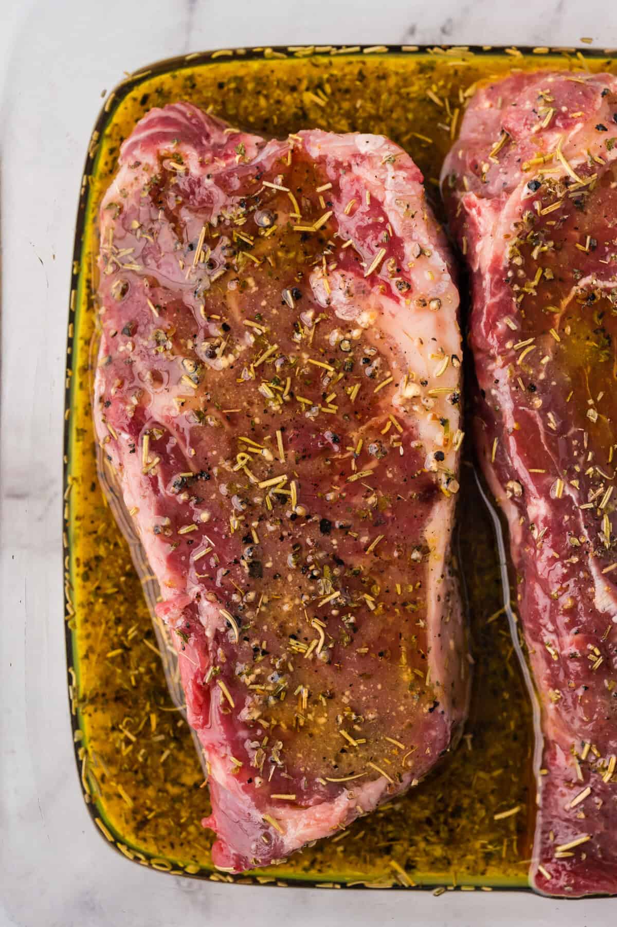 Steaks in steak marinade.