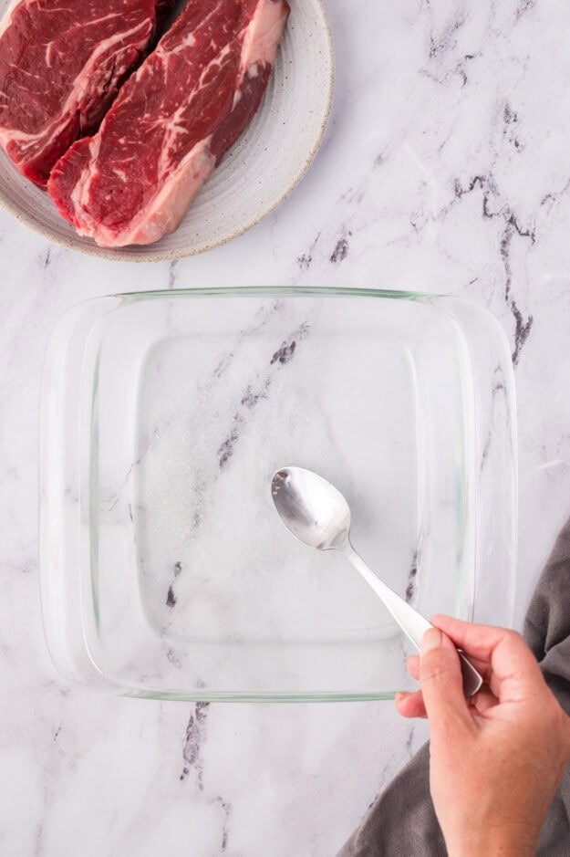 Hot water and salt in dish.
