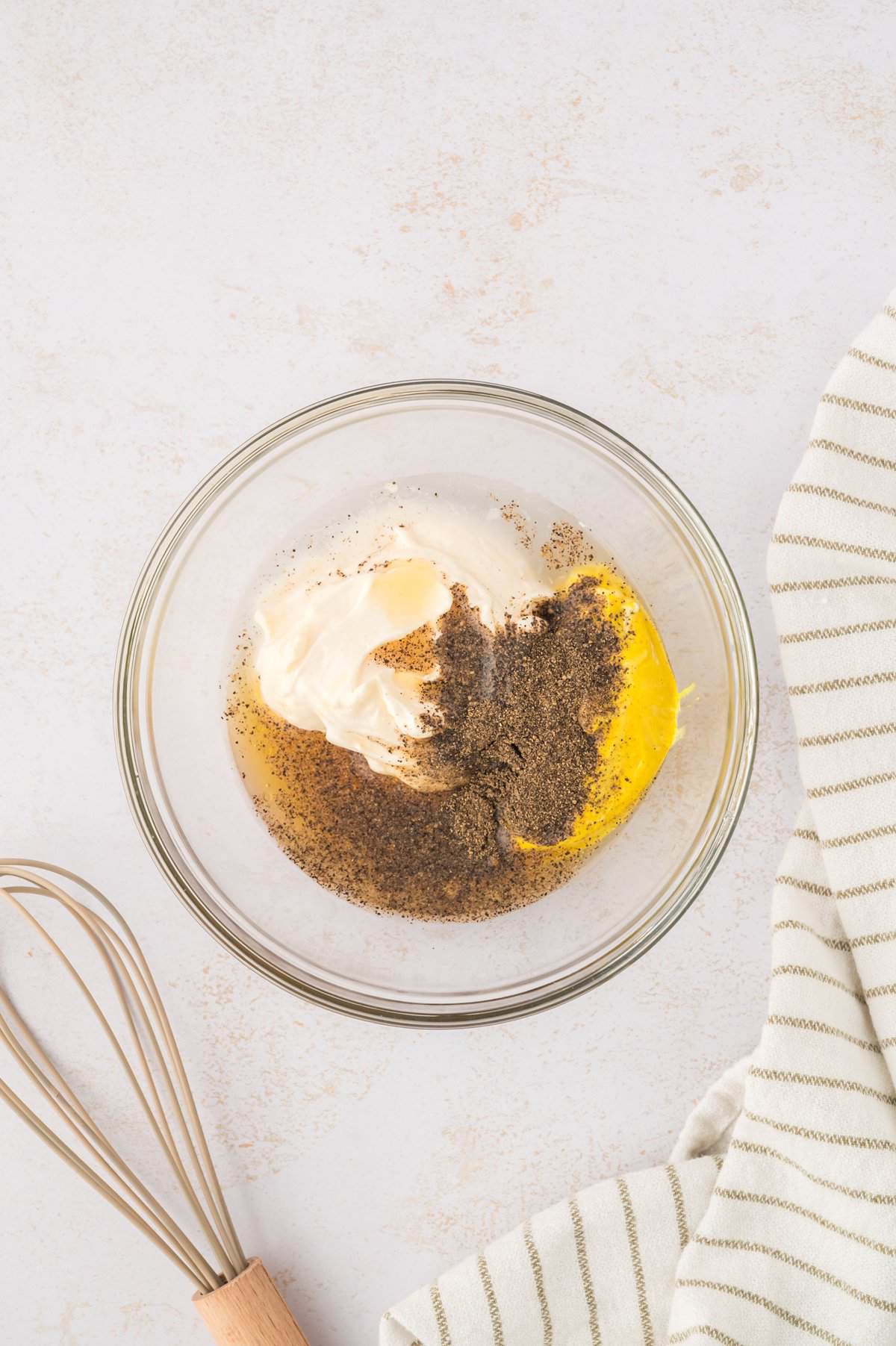 Honey mustard ingredients in mixing bowl.