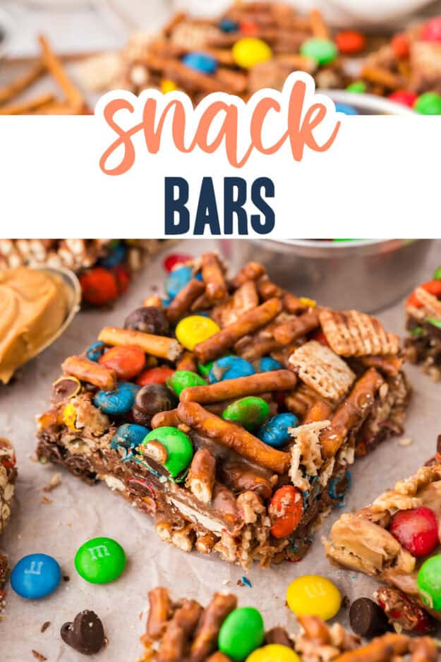 Snack bars surrounded by m&ms and pretzels.