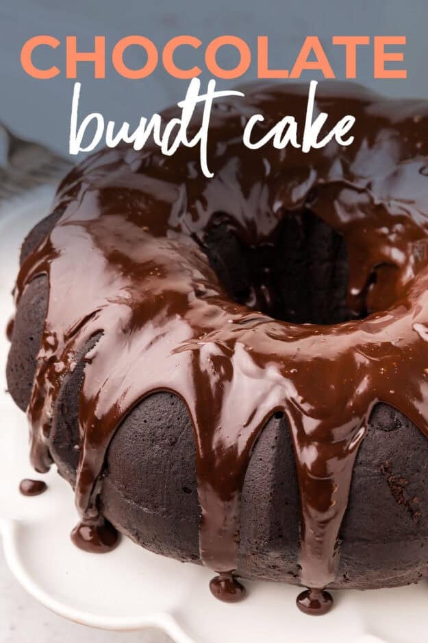 Bundt cake topped with ganache on cake plate.
