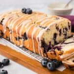 Blueberry muffin bread on cutting board.