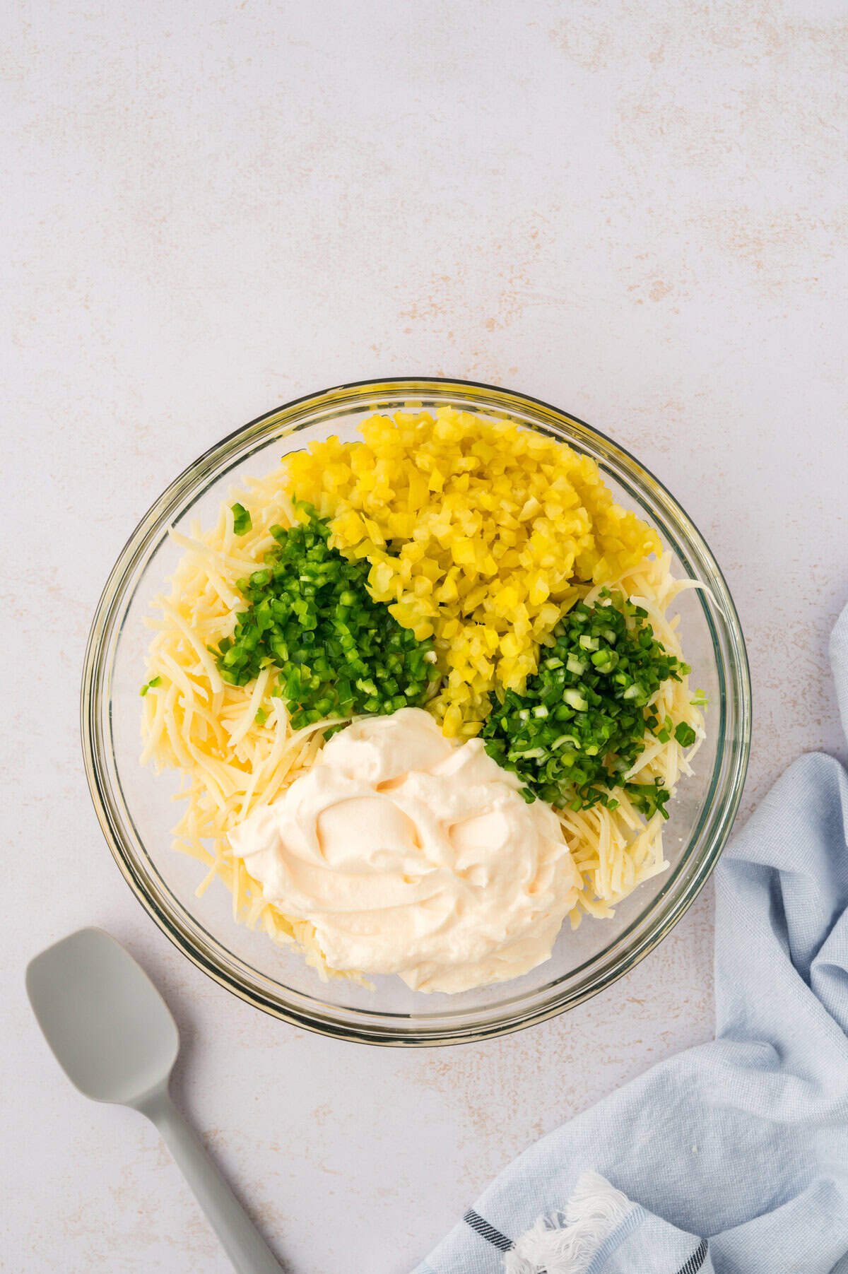 Ingredients for cheese slaw in mixing bowl.