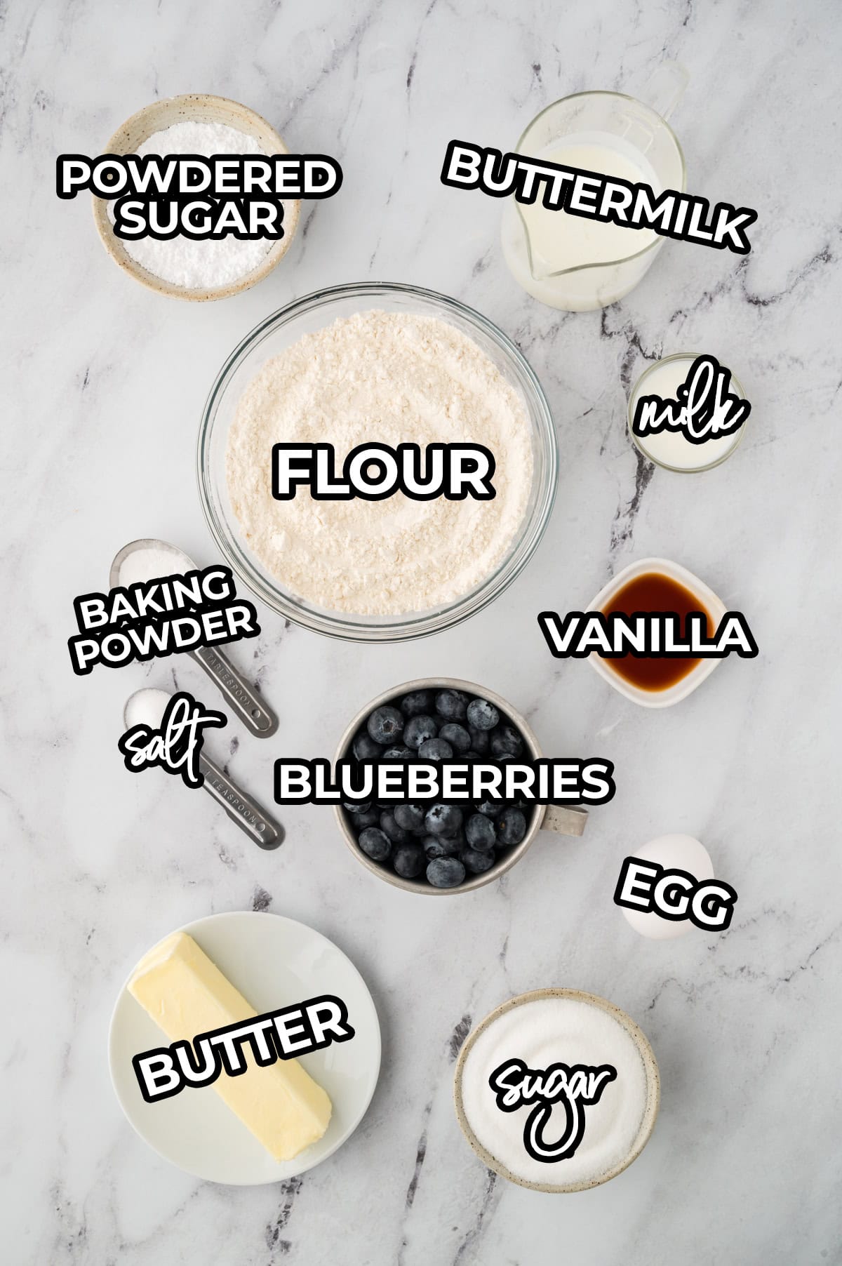 Ingredients for blueberry muffin bread laid out on counter.