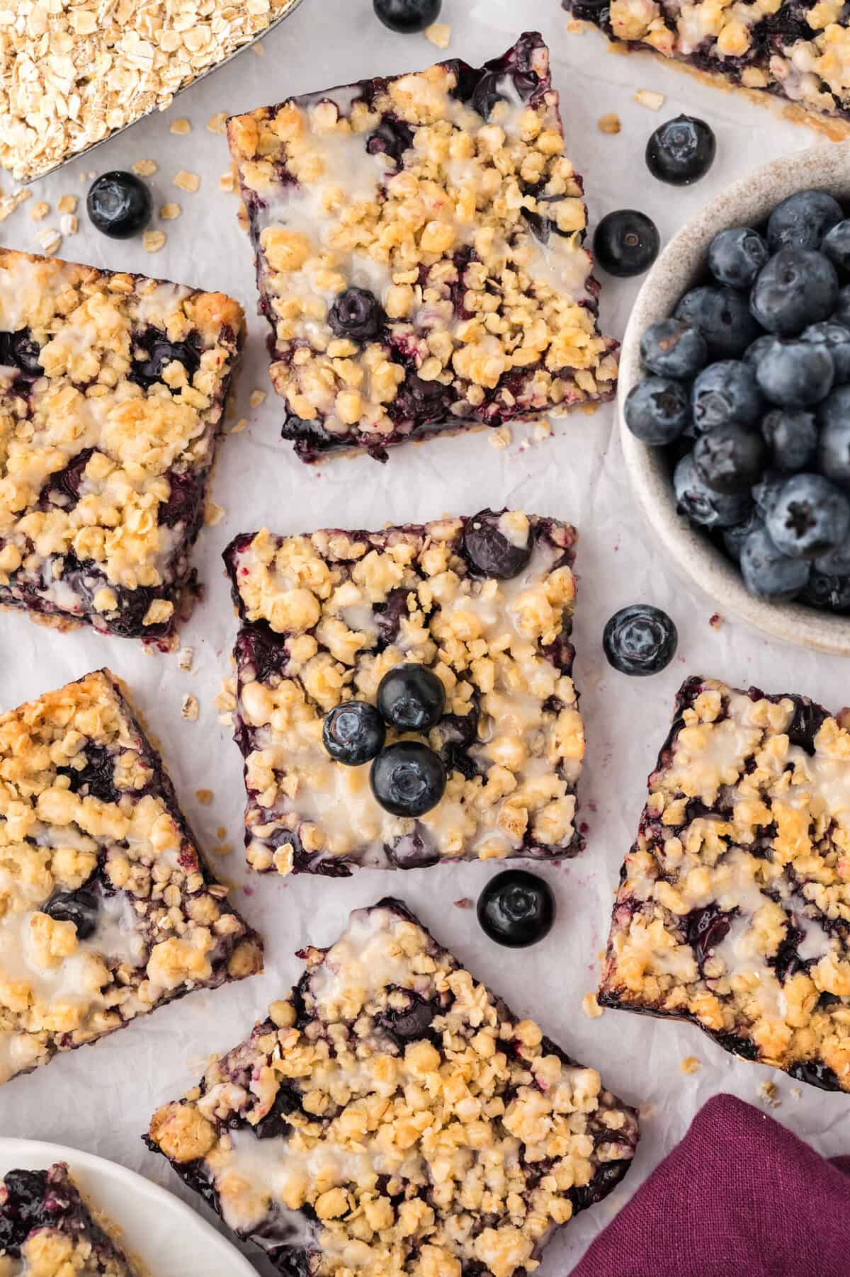 Overhead view of blueberry crumble bars cut and placed on counter.