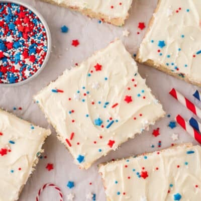 Frosted sugar cookie bars topped with 4th of July sprinkles.