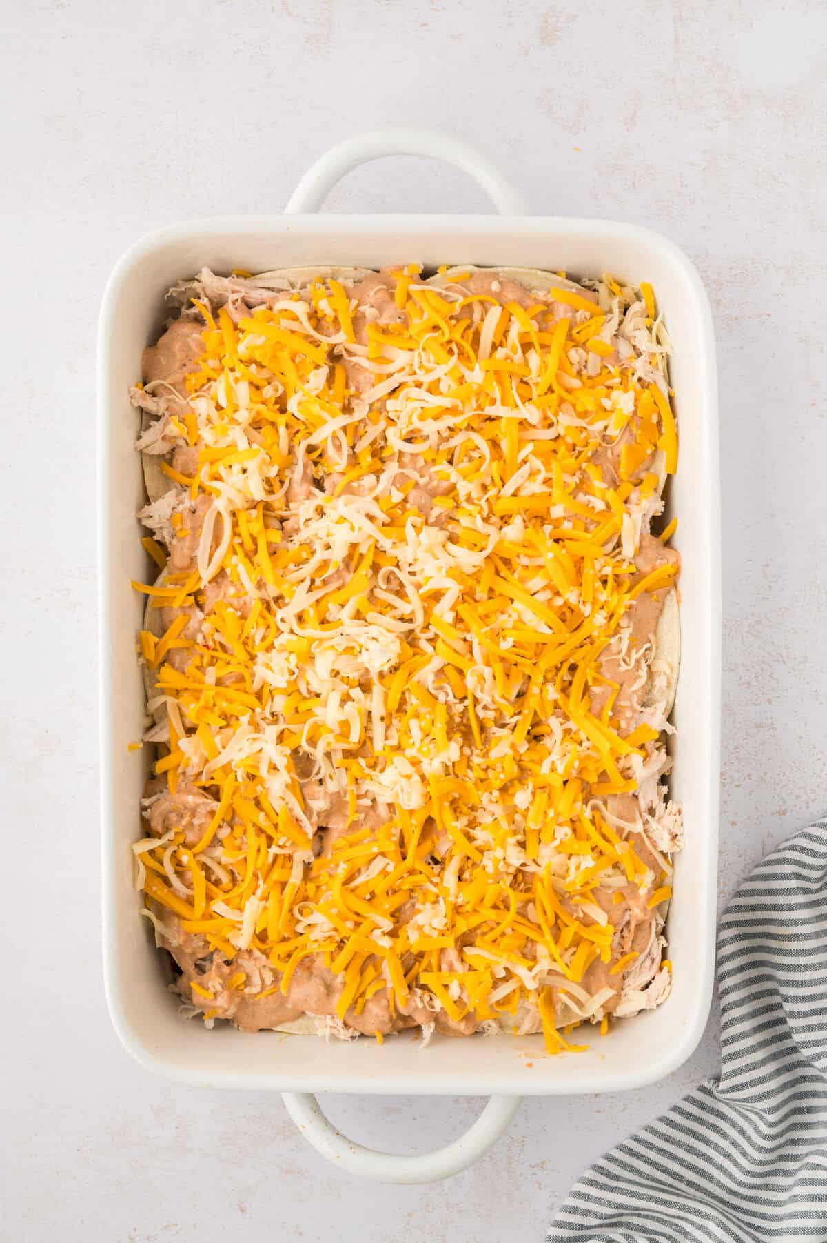 Cheese over casserole in baking dish.