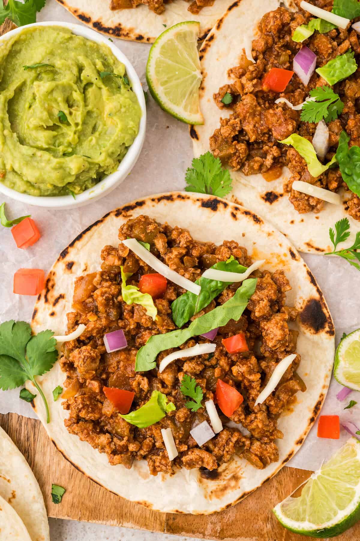 Overhead view of turkey tacos on platter.