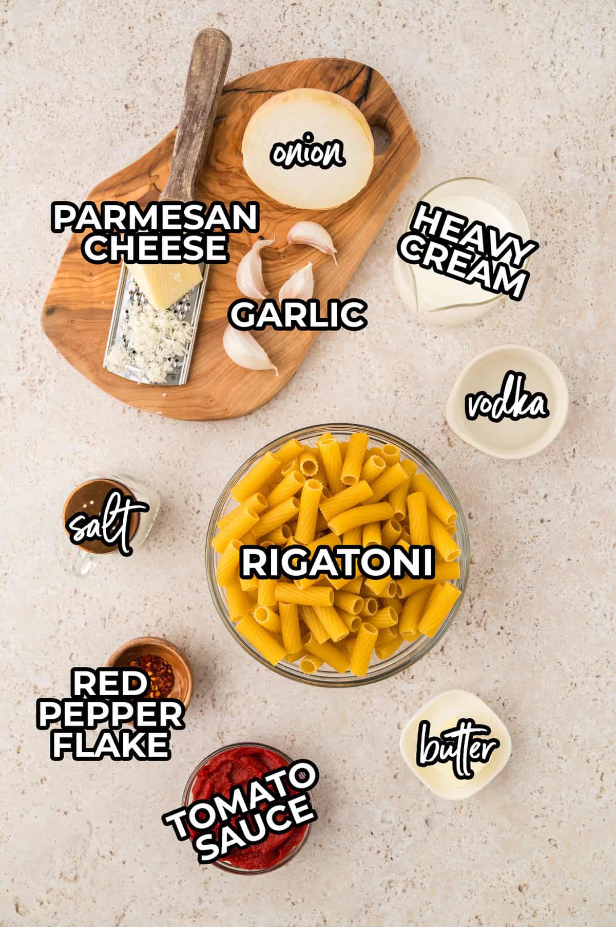 Ingredients for spicy rigatoni recipe laid out on counter.