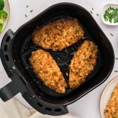 Crispy sour cream and onion chicken recipe in air fryer basket.