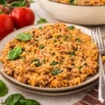 Ground beef orzo skillet recipe on white plate.