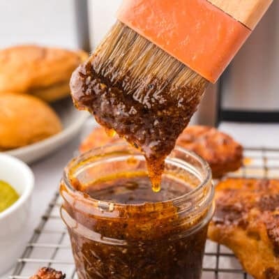 Nashville hot sauce dripping off basting brush.