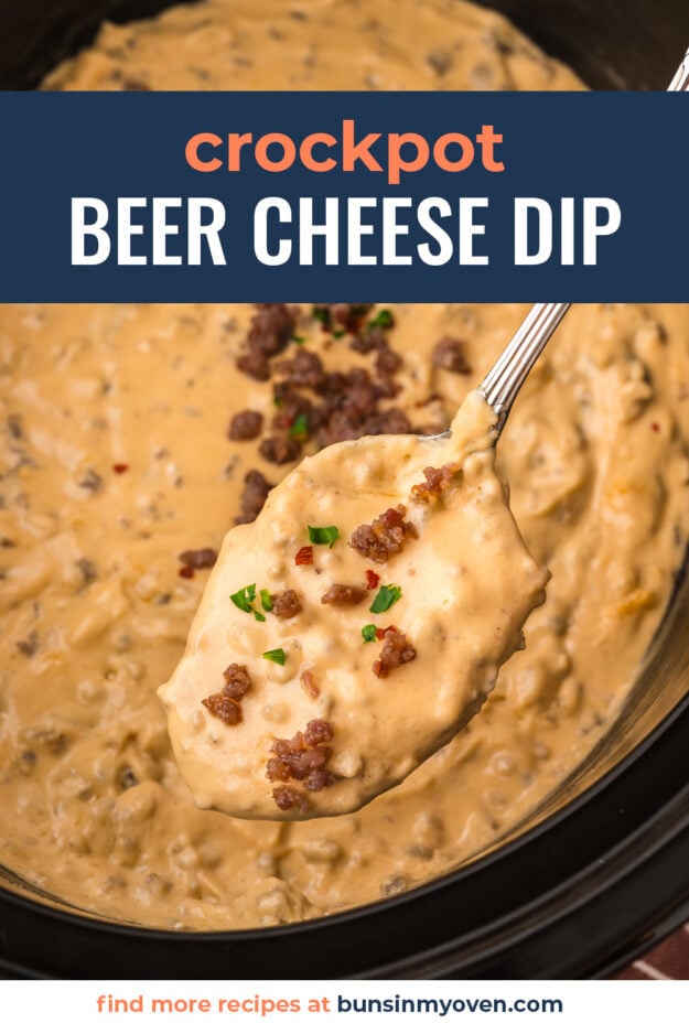 Hot sausage beer cheese dip in crockpot on a spoon.