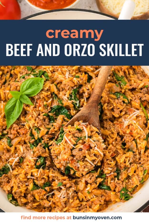 Skillet full of ground beef and orzo in tomato sauce.