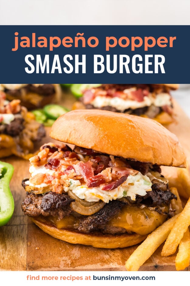 Burger topped with jalapeno popper filling on bun.