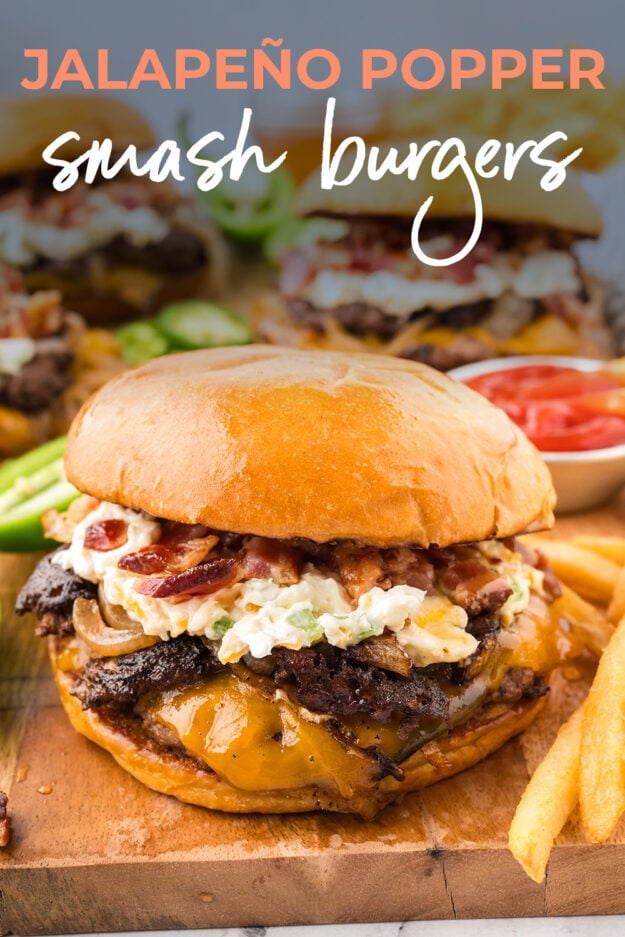Jalapeno popper cheeseburger on wooden board.