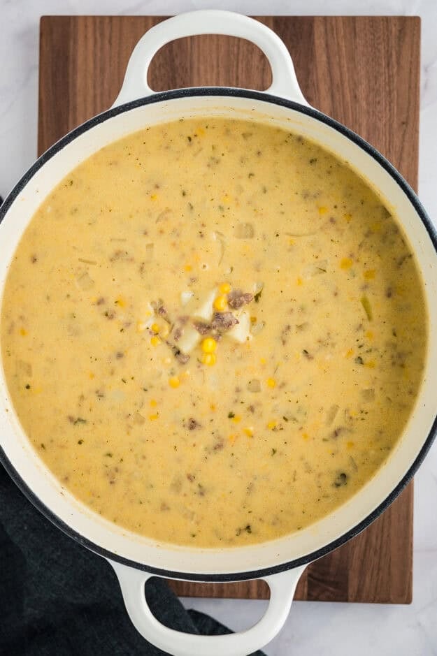 Cheeseburger soup in pot.