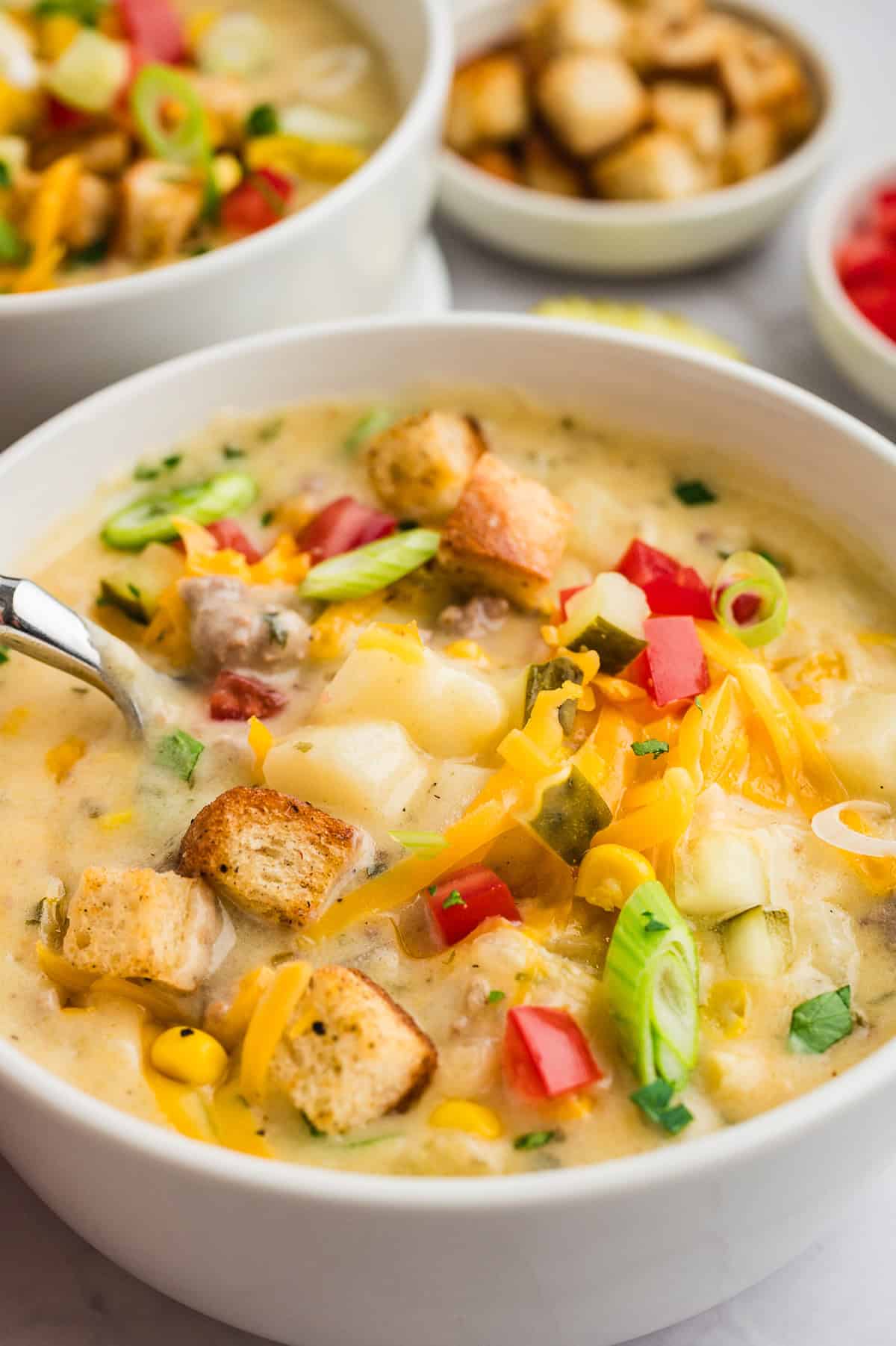 White bowl full of cheeseburger soup recipe.