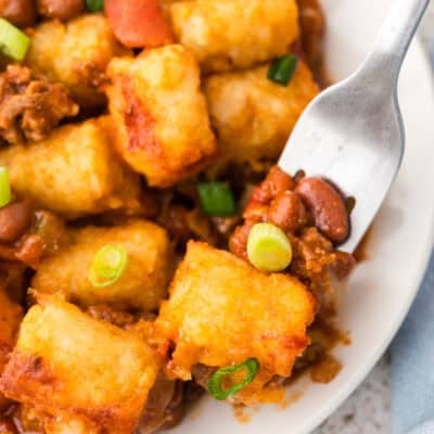 Plate full of chili cheese tater tot casserole with fork.