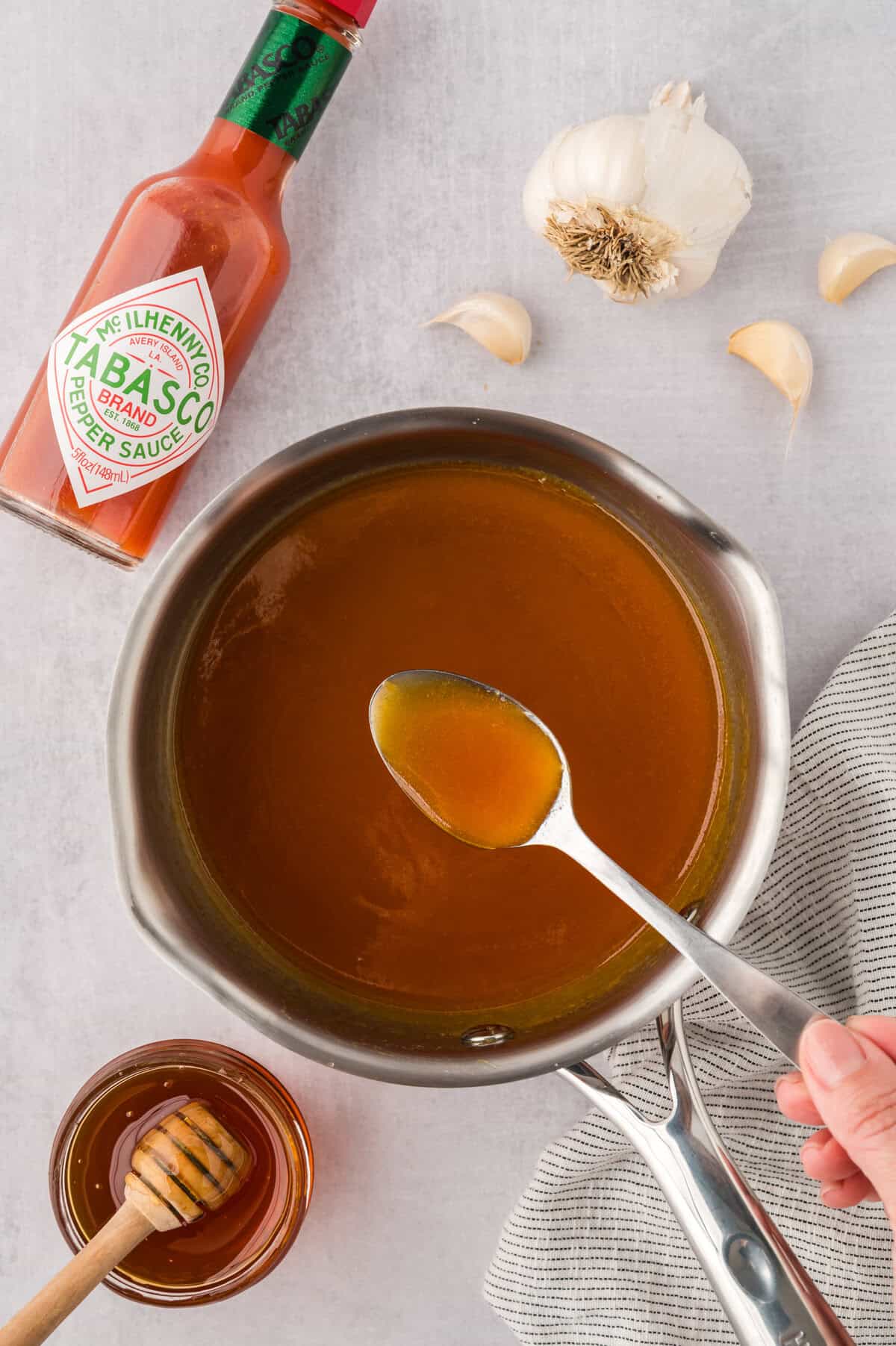 Saucepan full of homemade hot honey.