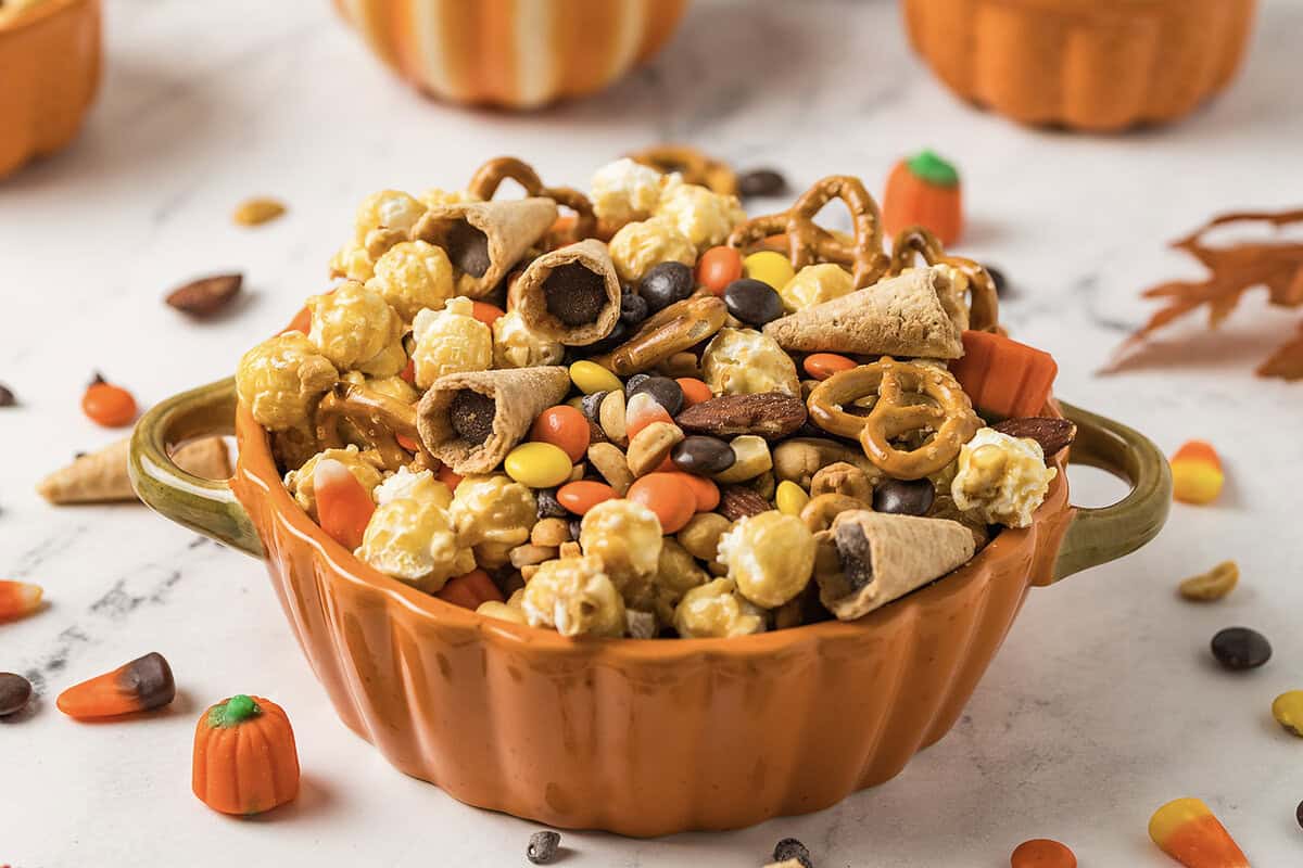 Fall snack mix in pumpkin shaped dish.