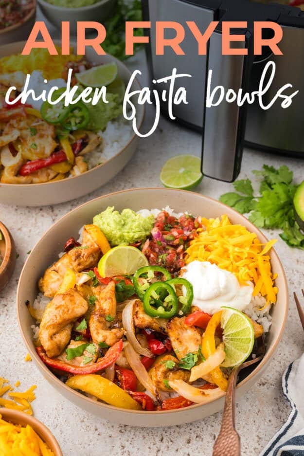 Bowl full of air fryer chicken fajitas with toppings.