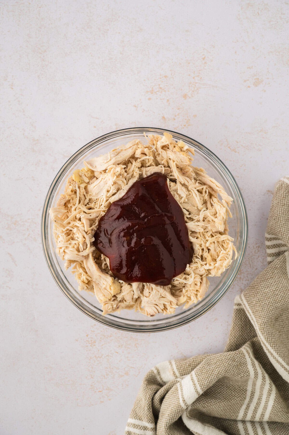 Shredded chicken topped with BBQ sauce.