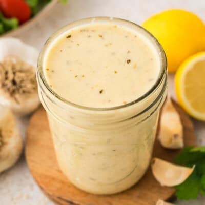 Jar full of homemade garlic dressing.
